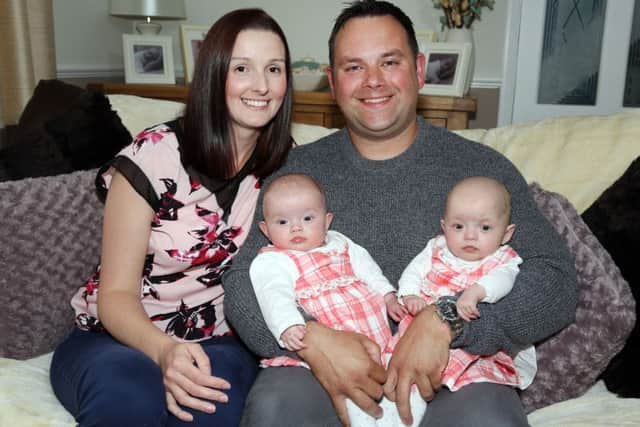 Father's Day: Rothwell: First fathers day with IVF twins Amie and Evie, born on Christmas Day 3 months premature. Dad Marc Owen, 38, with twins  Evie and Amie, and mum Cheryl Hutchins, 33. 

Tuesday June 14, 2016 NNL-160614-194946009