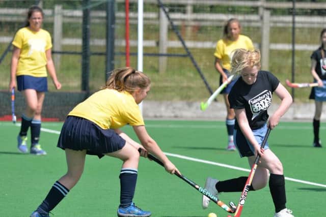 Lodge Park School (black) & Magadlen College School (yellow), yr 8/9 hockey. Northants School Games, Moulton College, 10/7/14 NNL-140715-114105001