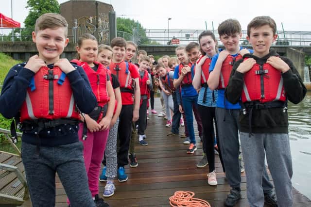Northants schoolchildren swan in the River Nene as part of an event promoting Water Saftey Week
