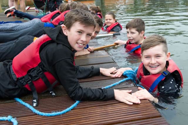Northants schoolchildren swan in the River Nene as part of an event promoting Water Saftey Week