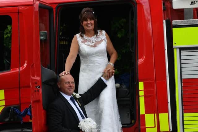 Dave and Yvonne Sinclair tied the knot in style at the weekend, by arriving in a working fire engine.