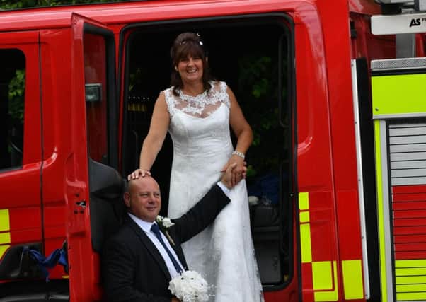Dave and Yvonne Sinclair tied the knot in style at the weekend, by arriving in a working fire engine.