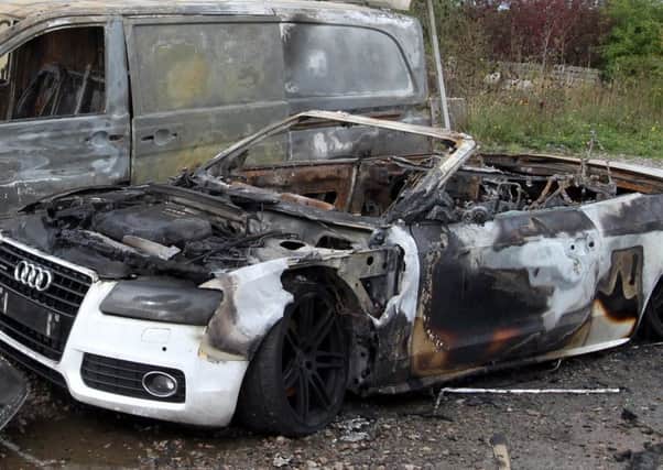 The vehicles which were destroyed by arsonists at the club in 2013