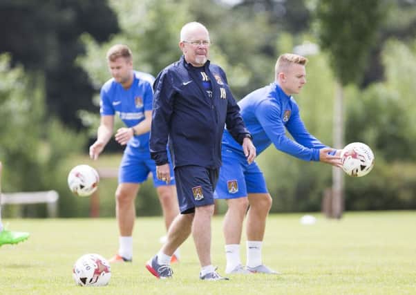 GETTING DOWN TO WORK - new Cobblers performance coach John Harbin oversees the first day of pre-season training at Moulton College (Pictures: Kirsty Edmonds)