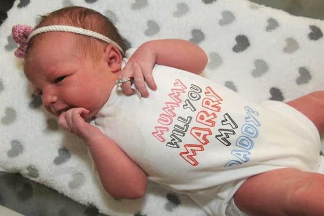 Newborn Beau Bell-Dale's 'mumy will you marry daddy' babygrow helped her dad make a romantic proposal. -Vy9Th7WbCfDRFQ4j1UV