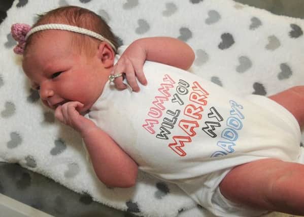 Newborn Beau Bell-Dale's 'mumy will you marry daddy' babygrow helped her dad make a romantic proposal. -Vy9Th7WbCfDRFQ4j1UV