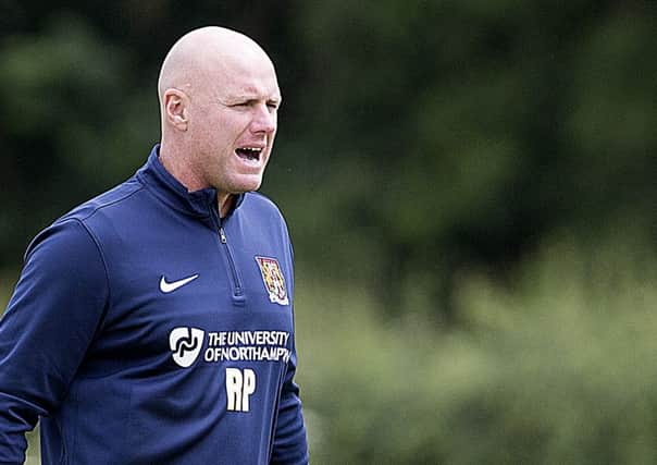DOWN TO WORK - Rob Page took charge of his first training session as Cobblers boss on Friday (Picture: Kirsty Edmonds)