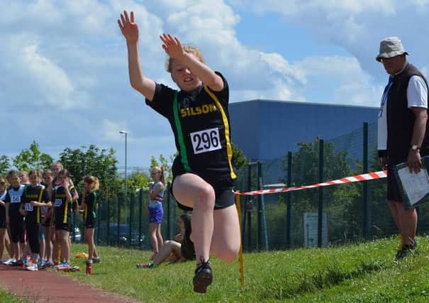 Bella Taylor in long-jump action for Silson Joggers at the Chairman's Cup in Kettering