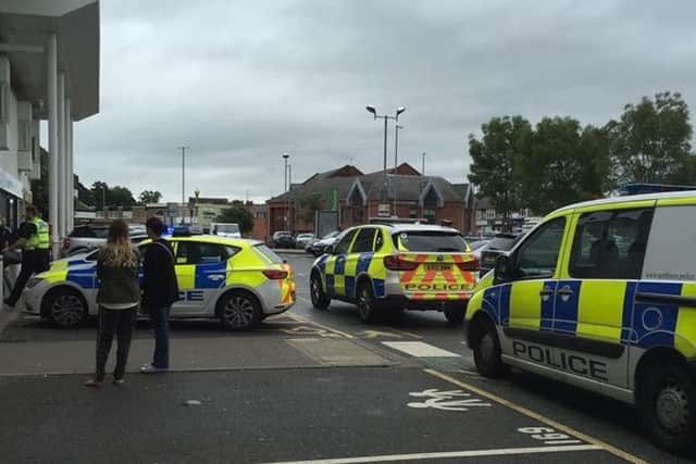 Police outside Waitrose in Kingsthorpe this morning. The store was evacuated after reports of a man carrying a bladed weapon. Picture by Donna Brown.