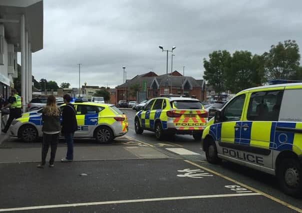 Police outside Waitrose in Kingsthorpe this morning. The store was evacuated after reports of a man carrying a bladed weapon. Picture by Donna Brown.