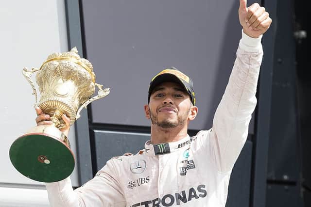 THUMBS UP! - Lewis Hamilton enjoys his win at Silverstone (Pictures: Kirsty Edmonds)