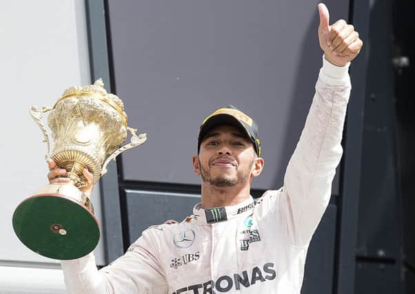 THUMBS UP! - Lewis Hamilton enjoys his win at Silverstone (Pictures: Kirsty Edmonds)