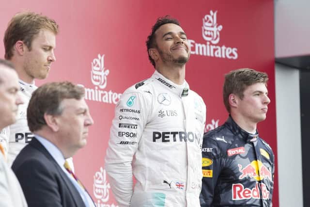 HAPPY MAN - Lewis Hamilton savours his British GP win on Sunday (Picture: Kirsty Edmonds)