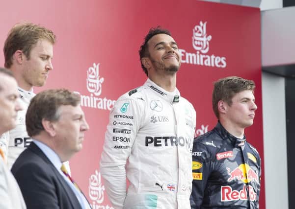 HAPPY MAN - Lewis Hamilton savours his British GP win on Sunday (Picture: Kirsty Edmonds)