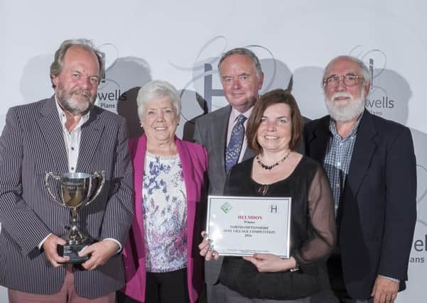 Helmdon - Overall 2016 Best Village Competition winner and winner of the medium sized villages cup. Photo shows villagers Ross Vicars, Sarah Adhemar & John Coatsworth  receiving the cup from Annette & Paul Hollowell, sponsors of the competition.