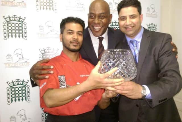TV chef Ainsley Harriott with staff from Saffron in Northampton after winning the Tiffin Cup
