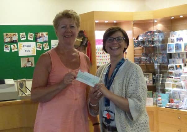 Jane Brodie presented over Â£3,000 to Cynthia Spencer Hospice