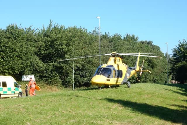 The air ambulance coming into land at Great Billing Way.
