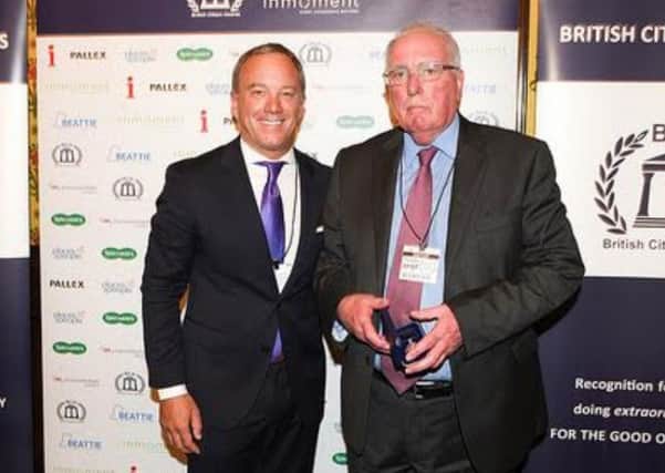 received his BCAe Medal from InMoments president Lonnie Mayne at the Palace of Westminster