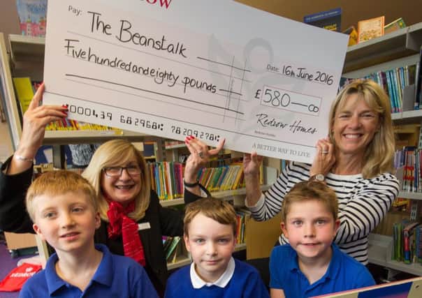 Redrow Sales Consultant Olga Hagan presents the Â£580 cheque to Teresa Quigly from the Beanstalk Reading Partnership. watched by yr 3 pupils Ethan, Sam and George. June 16 2016

Matthew Power Photography
www.matthewpowerphotography.co.uk
07969 088655
mpowerphoto@yahoo.co.uk
@mpowerphoto