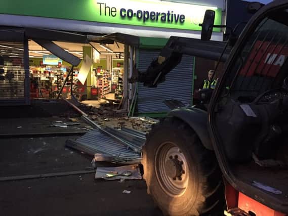 Thieves used a digger to smash into a Co-op in Wollaston and steal a cash machine. Pic by Sgt Darron Bishop