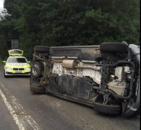 Police were called out after a car overturned on the A428 in East Haddon. Pic by Sgt Sam Dobbs