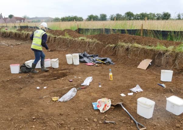 Two ancient skeletons have been found by surveyors at a new housing development.