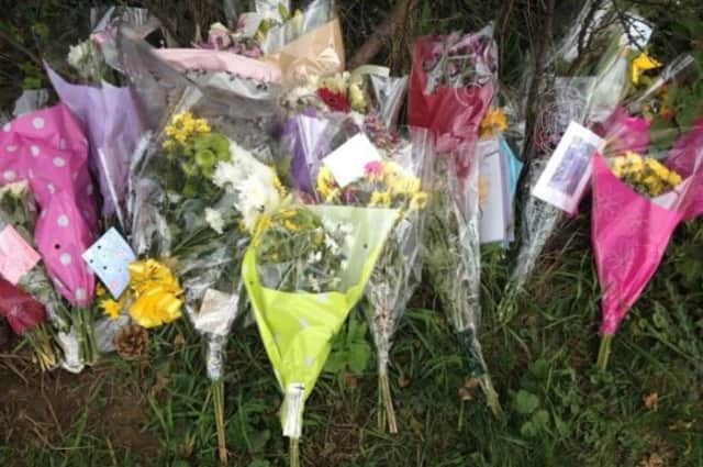 Flowers at the scene where Mary Davies died after being involved in a collision with a car.