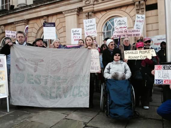Members of the public, union members and service users protested against the planned Â£65m worth of cuts to the county council outside County Hall in February. Now more cuts are on the horizon.