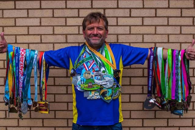 Stuart Mellows with his haul of medals