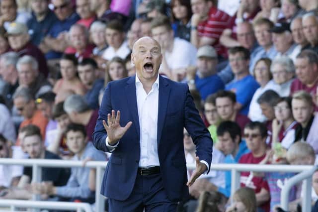 Uwe Rosler barks out the instructions on the touchline at Sixfields. Picture by Kirsty Edmonds