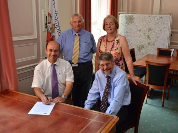 Professor Simon Denny and Cllr Andre Gonzalez De Savage signing the agreement