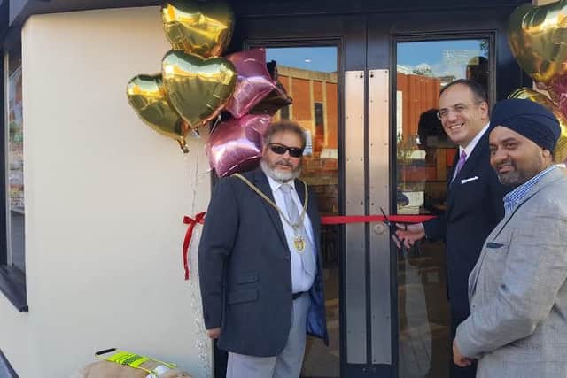 The Mayor of Northampton Councillor Christopher Malpas (left), Northampton MP Michael Ellis (middle) has officially opened a new Burger King in the town centre run by Sukhi Panesar (right)