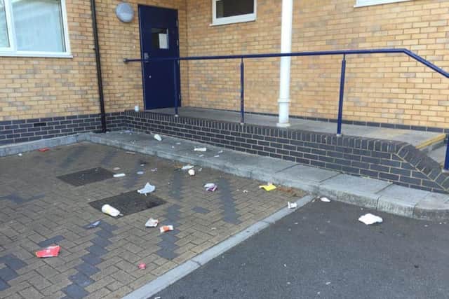 Litter strewn across the car park.