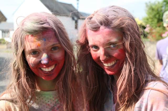 Bryony Freestone and sister Sophie taking part in the Little Houghton Colour Run in 2013.