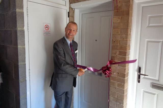 Cllr Burton officially opens one of the new properties.