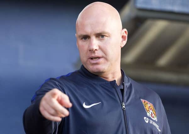 Cobblers boss Rob Page watches his side draw 0-0 at Oldham (Picture: Kirsty Edmonds)