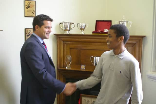 Mubarak Osman, pictured here with headmaster Richard Bernard got three A* grades in biology, chemistry and maths at Northampton School for Boys. Mubarak is now applying to study medicine.