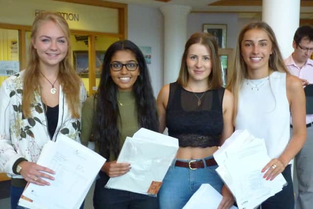 Jasmine Smellie, Pankti Patel, Louise Penn, Eleanor Parton, celebrate their A-level grades at Northampotn High School this morning.