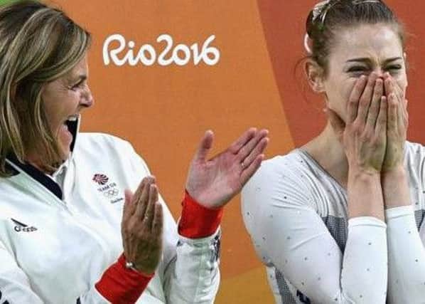 EMOTIONAL MOMENT - Northamptons Tracy Whittaker-Smith (left) shows her delight after Bryony Page (right) claimed a trampolining silver medal at the Olympics in Rio