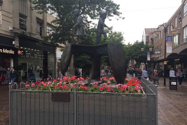 Barriers have been placed around the Cobblers Last statue in Abington Street, after the area had become a hotspot for congregating groups and anti-social behaviour.