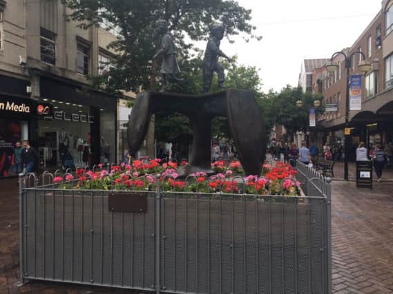 Barriers have been placed around the Cobblers Last statue in Abington Street, after the area had become a hotspot for congregating groups and anti-social behaviour.