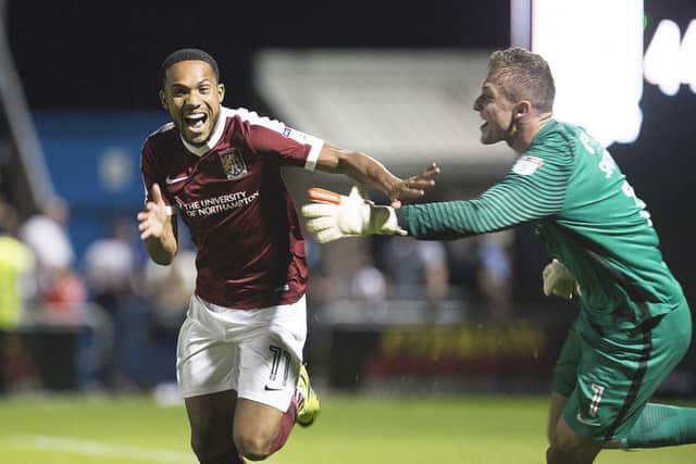 JUBILATION: Kenji Gorre wheels away in celebration after netting the winning spot-kick. Pictures: Kirsty Edmonds