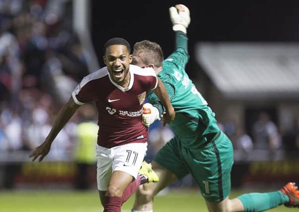 CUP HEROICS - Kenji Gorre celebrates scoring the winning penalty in Tuesday's shootout win over West Brom. Now the Cobblers face a third round date with Manchester United (Picture: Kirsty Edmonds)