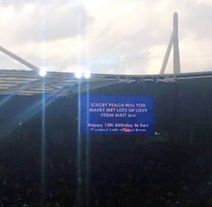 Romantic Leicester City fan Matt Yeoman stunned his girlfriend Stacey Peach by proposing to her on the big screen before kick-off at the Premier League champions' ground.