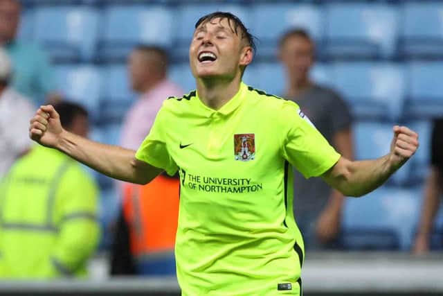 OFF THE MARK: Harry Beautyman celebrates his first Cobblers goal. Pictures: Sharon Lucey