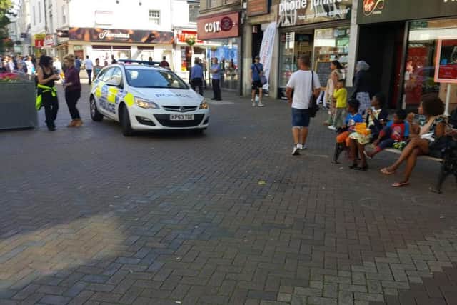 Shoppers were forced to quickly move out of the way as a police car drove down Abington Street