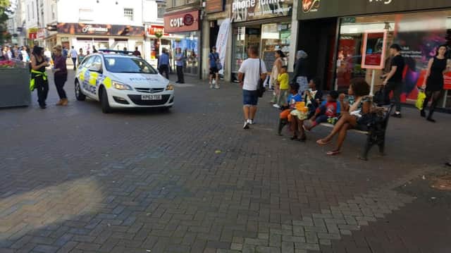 Shoppers were forced to quickly move out of the way as a police car drove down Abington Street