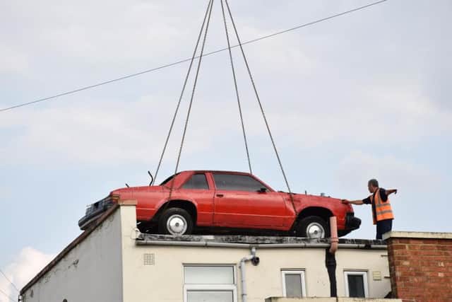 The car on the roof of Super Sausage II has been removed.