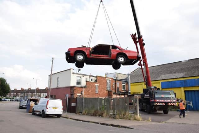 The car on the roof of Super Sausage II has been removed.